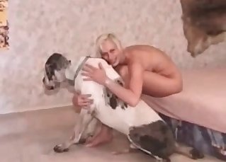 Possessive blonde seducing her dog